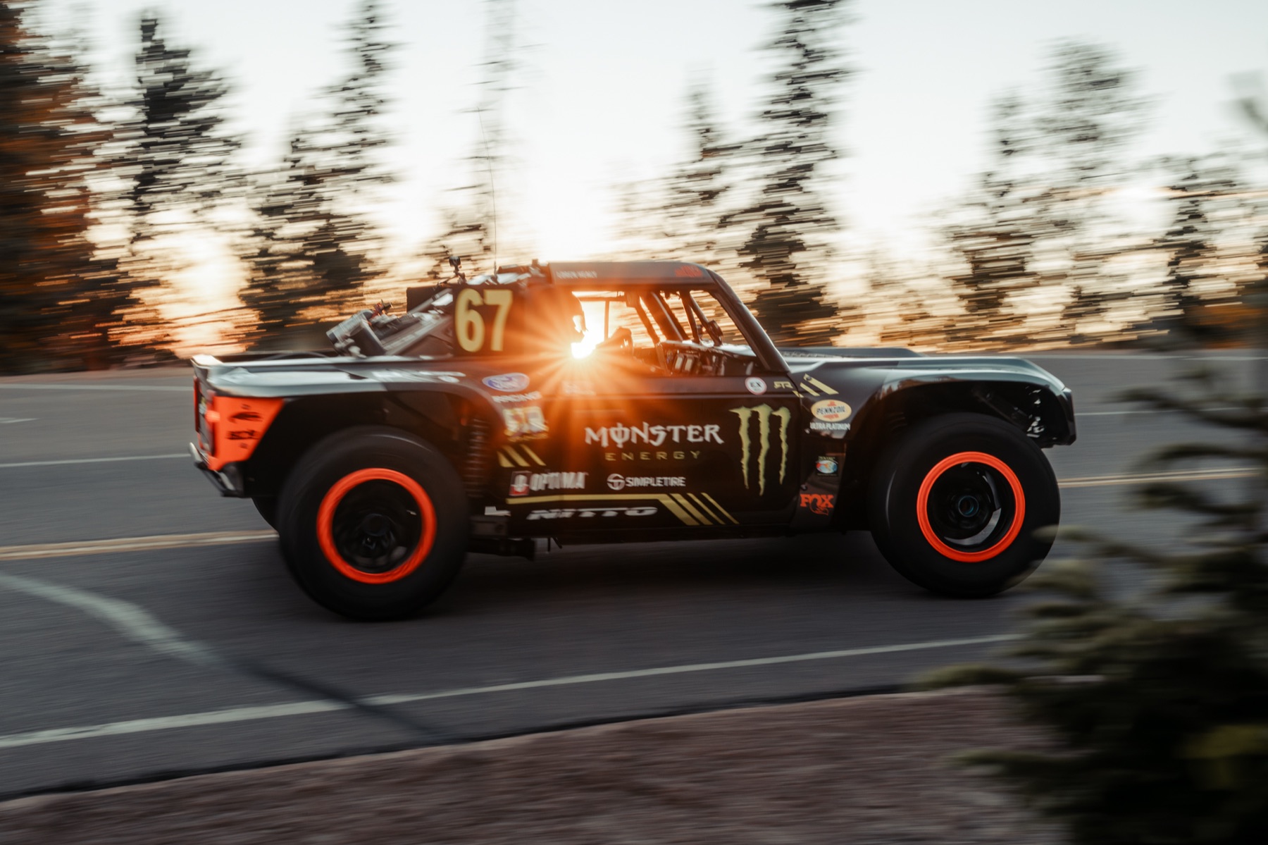 Trophy truck at speed through the trees, Pikes Peak Hill Climb