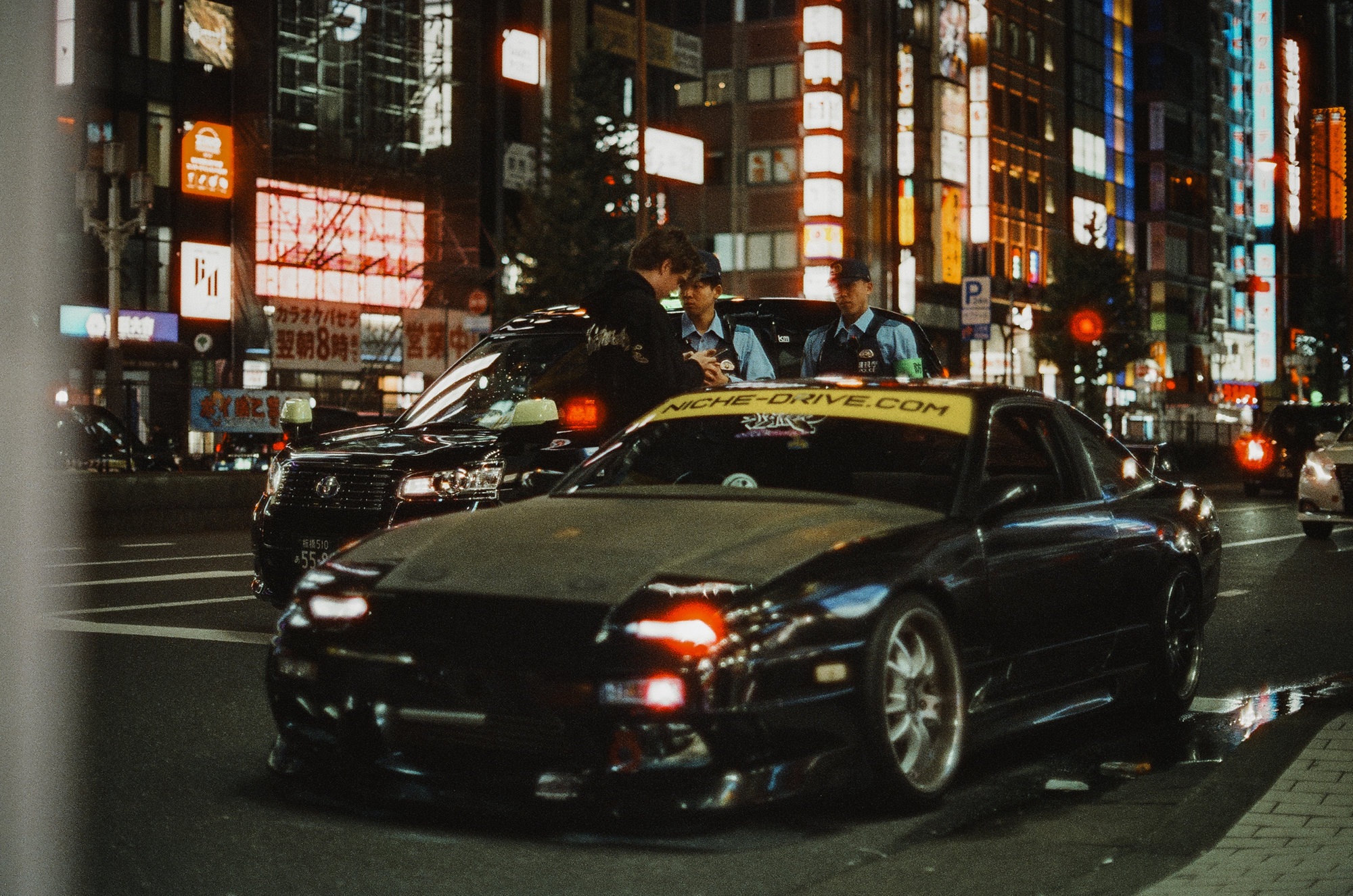 Nissan 180SX under Shinjuku neon at night — Japan on 35mm film